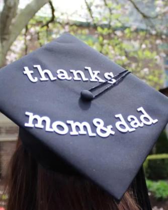 Close-up of graduation cap that reads "Thanks Mom and Dad" at Mercyhurst