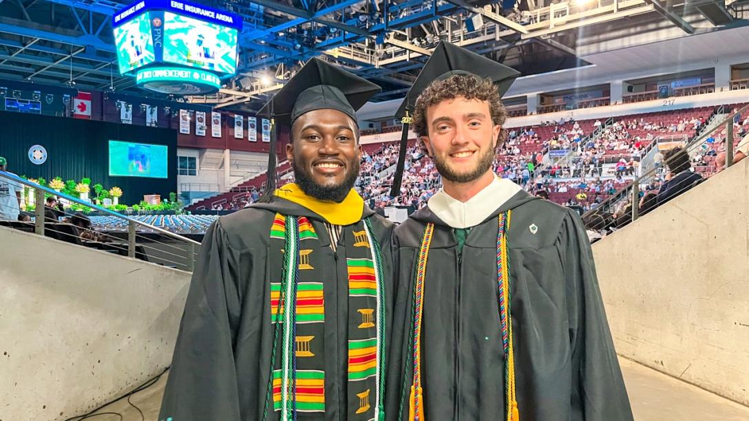 Two students at commencement