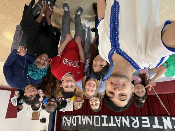 Mohcine Mo Khadraoui takes a selfie with a group of students