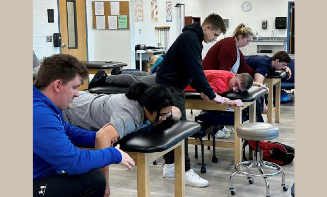 PTA students practice skills in a lab setting.