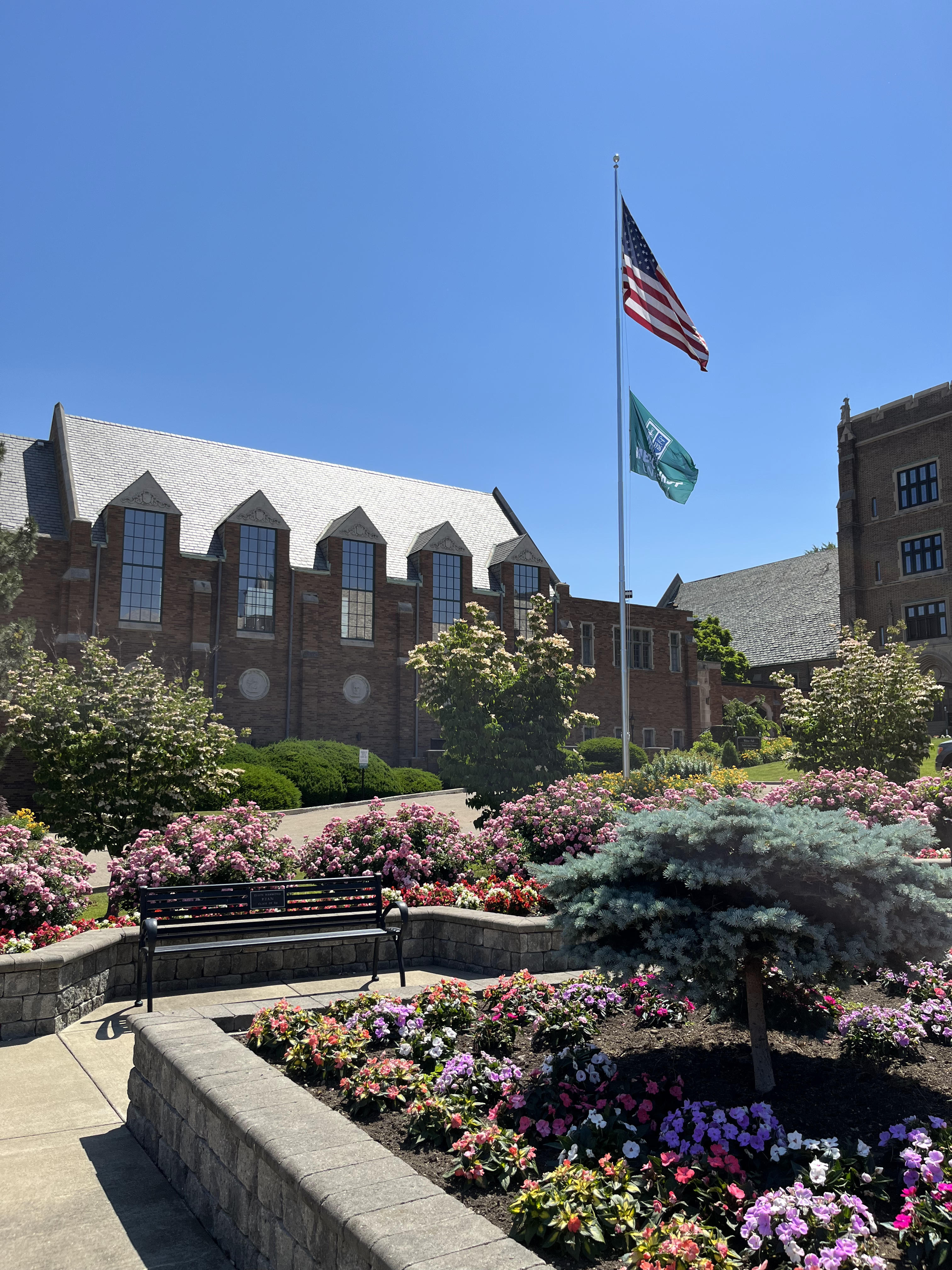 mercyhurst old main and flagpole