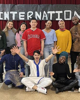Mohcine “Mo” Khadraoui and 12 other Mercyhurst students posing for a photo on International Day