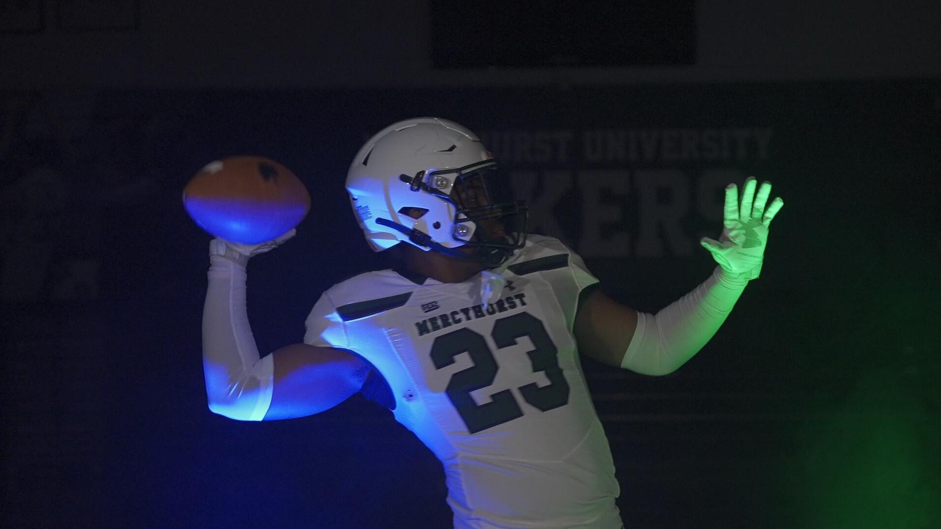 Mercyhurst Football Player throwing a football in the Athletic Center