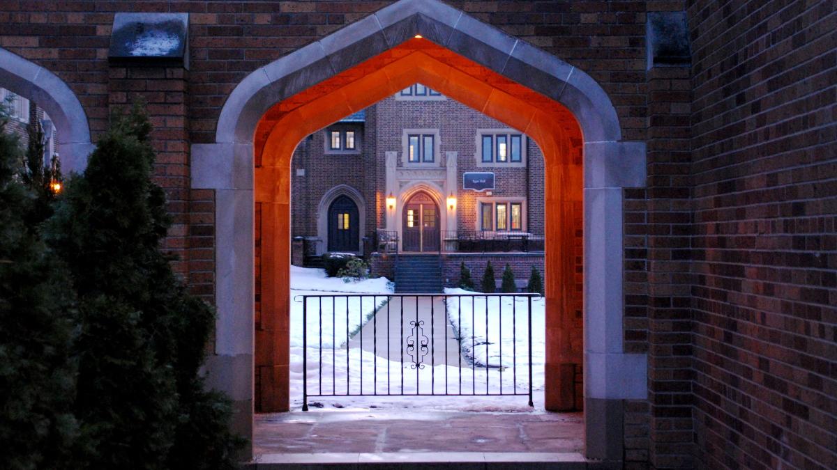 Egan Hall through the Old Main archway in winter