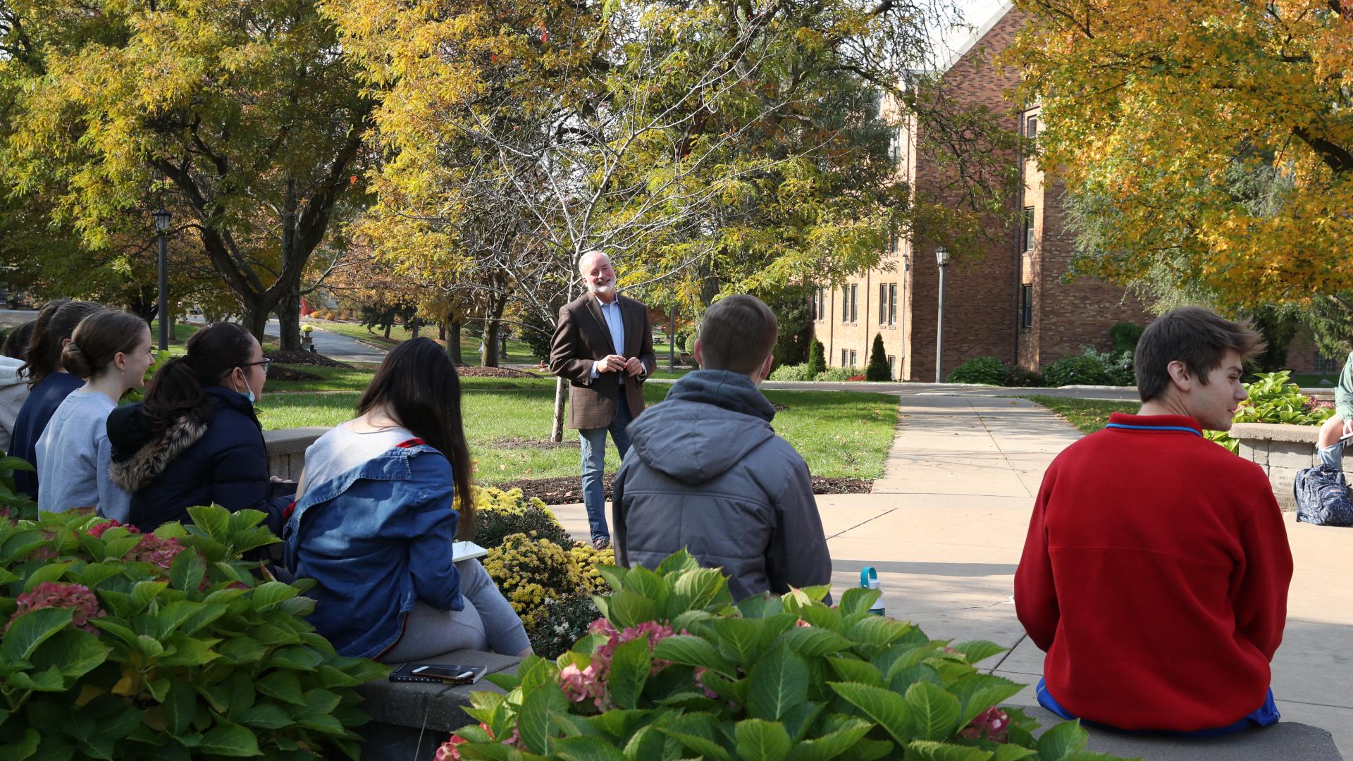 Students sitting outside for class