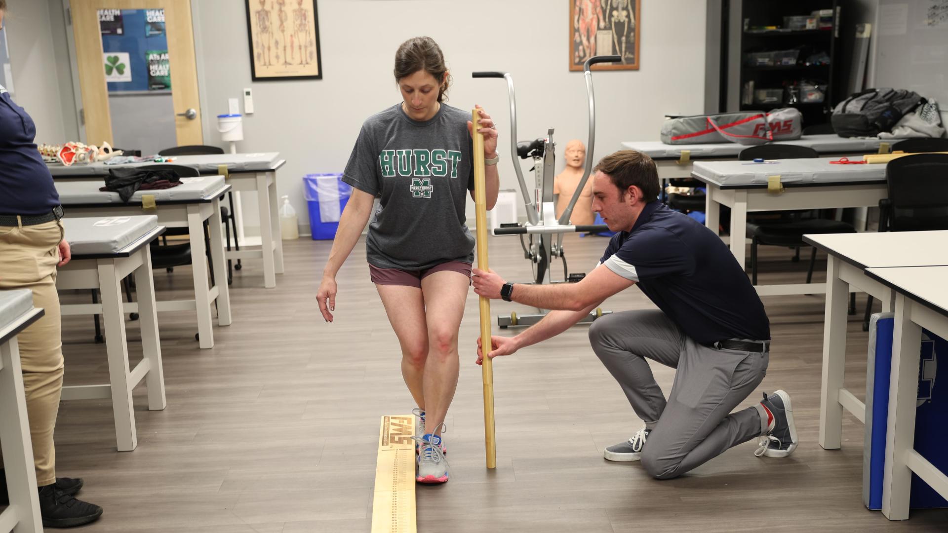 Students practicing athletic training skills.