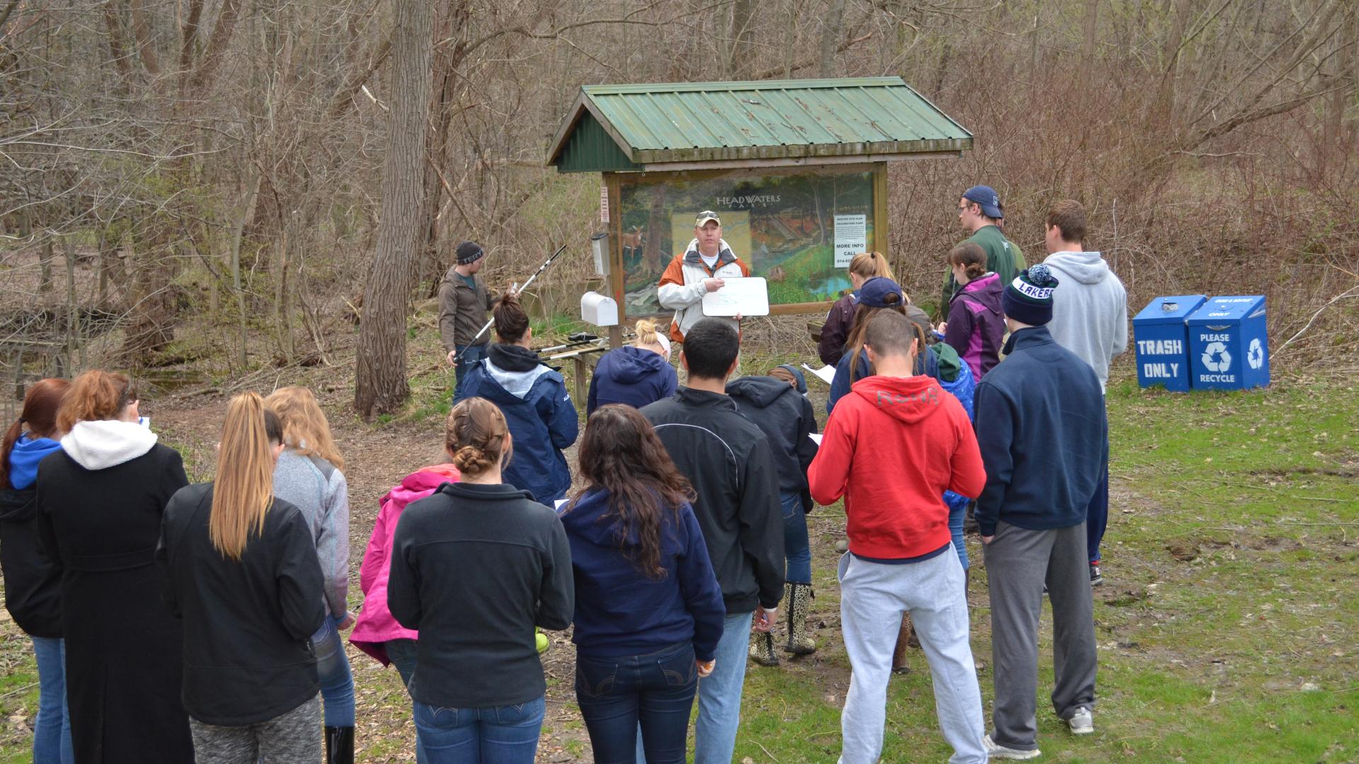 Environmental Science in front of a trail map