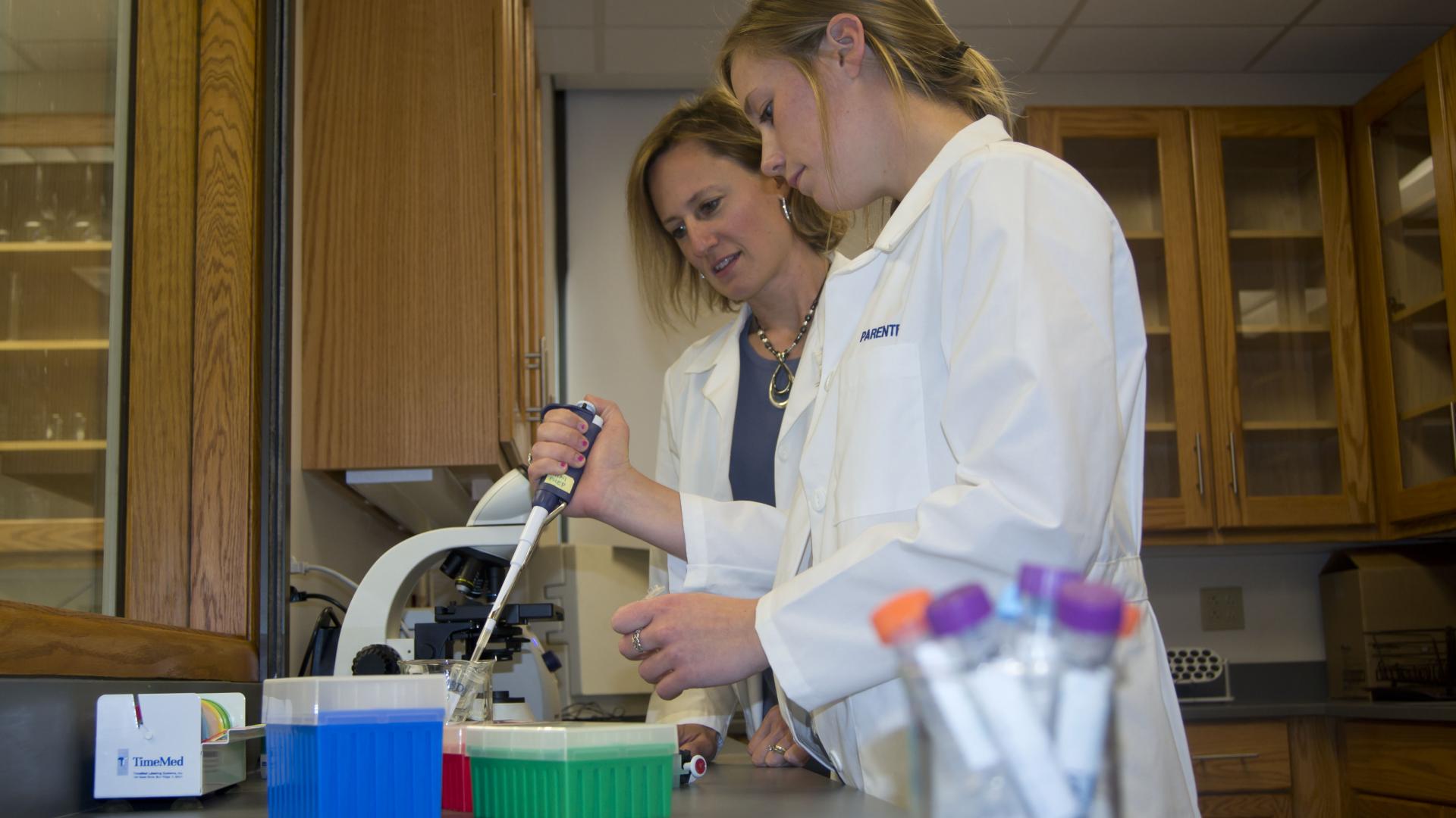 Professor and student working in lab