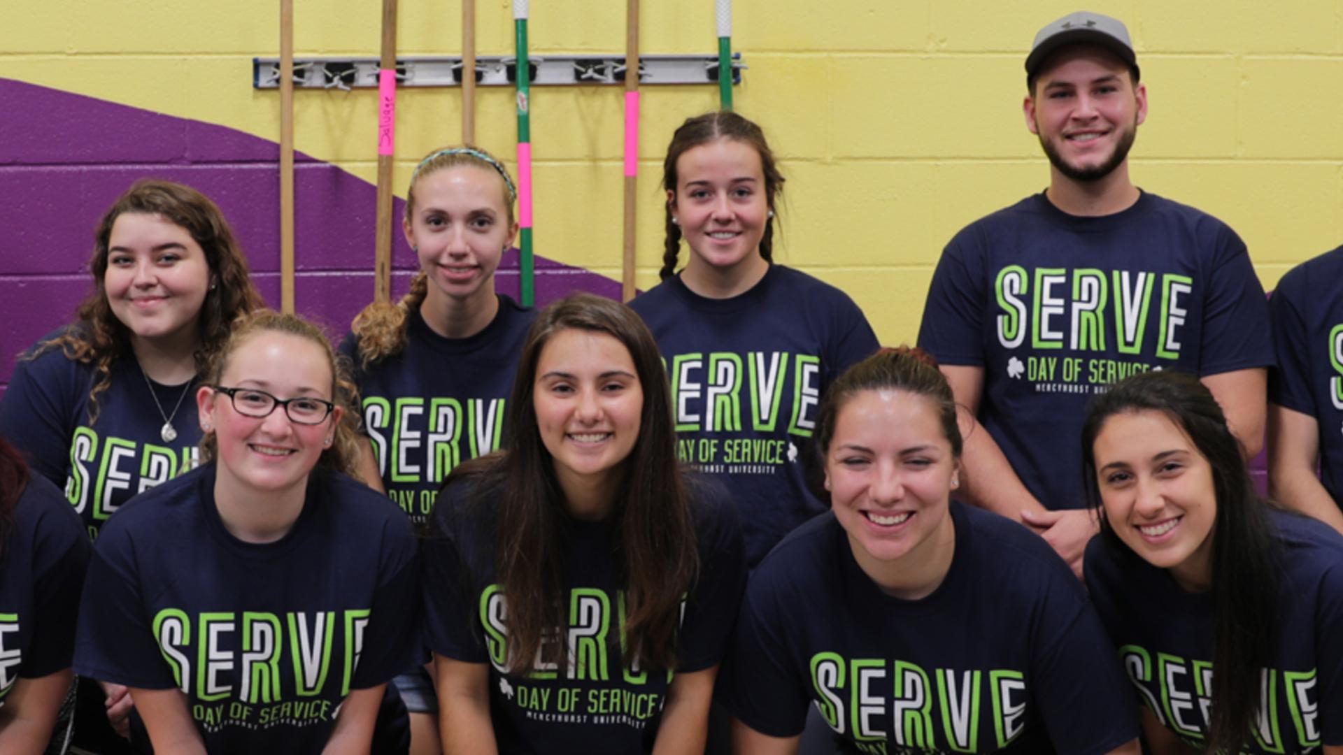 Students posing in Service T-Shirts