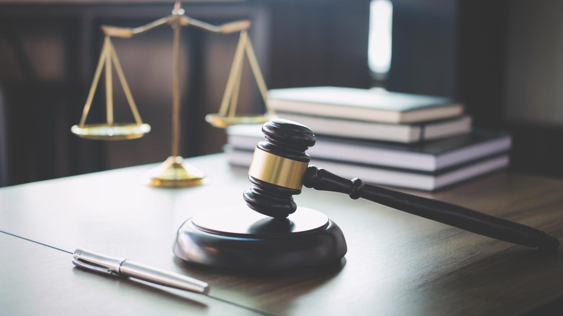 desk with gavel, books, and scales