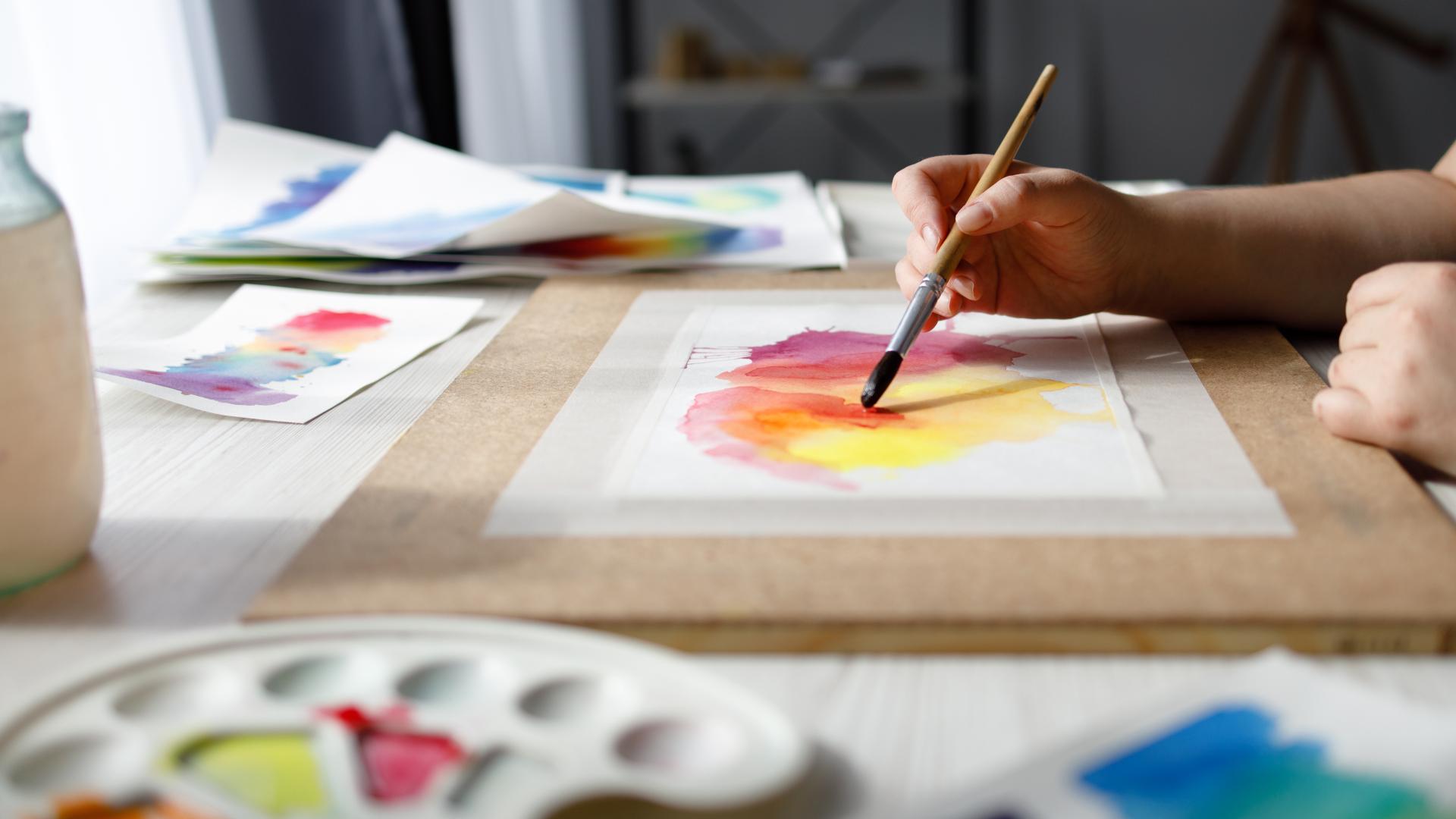 Woman painting with watercolors