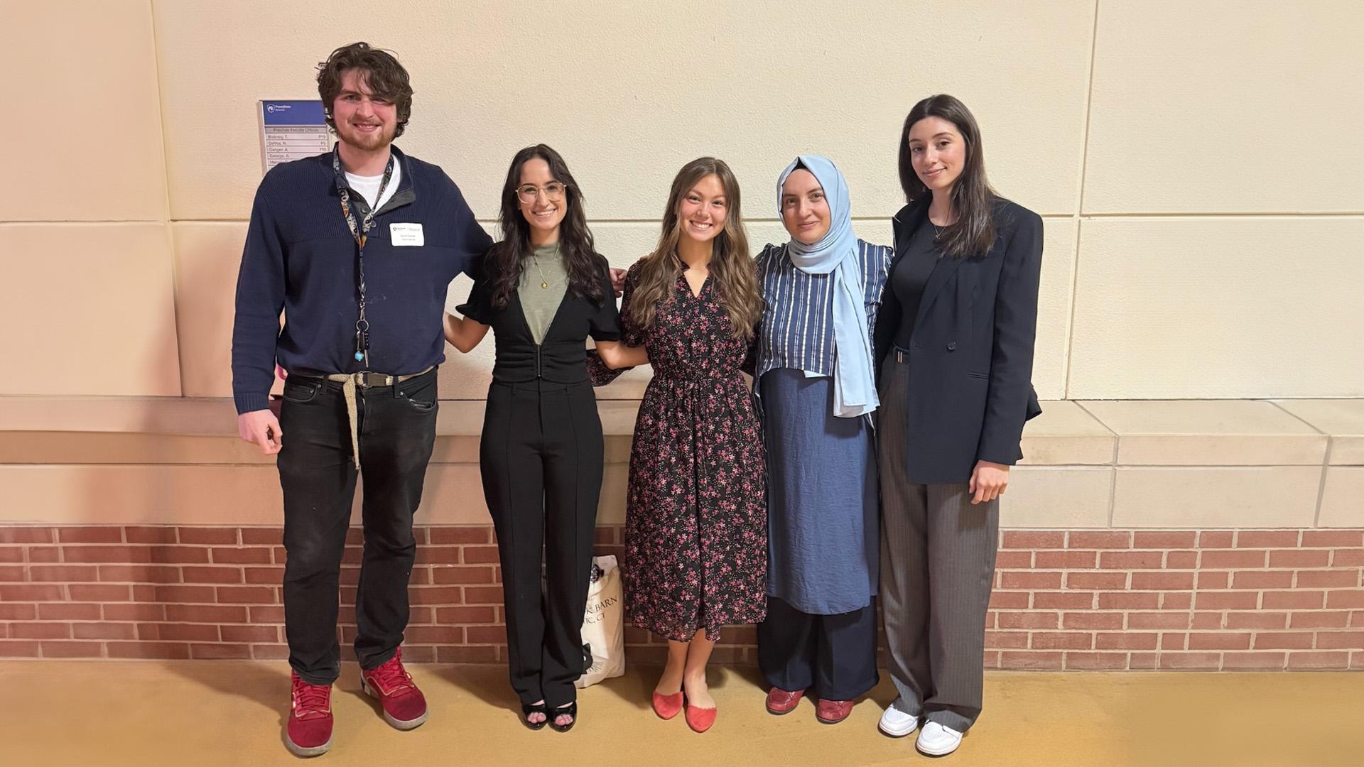 Seyma with students at a conference