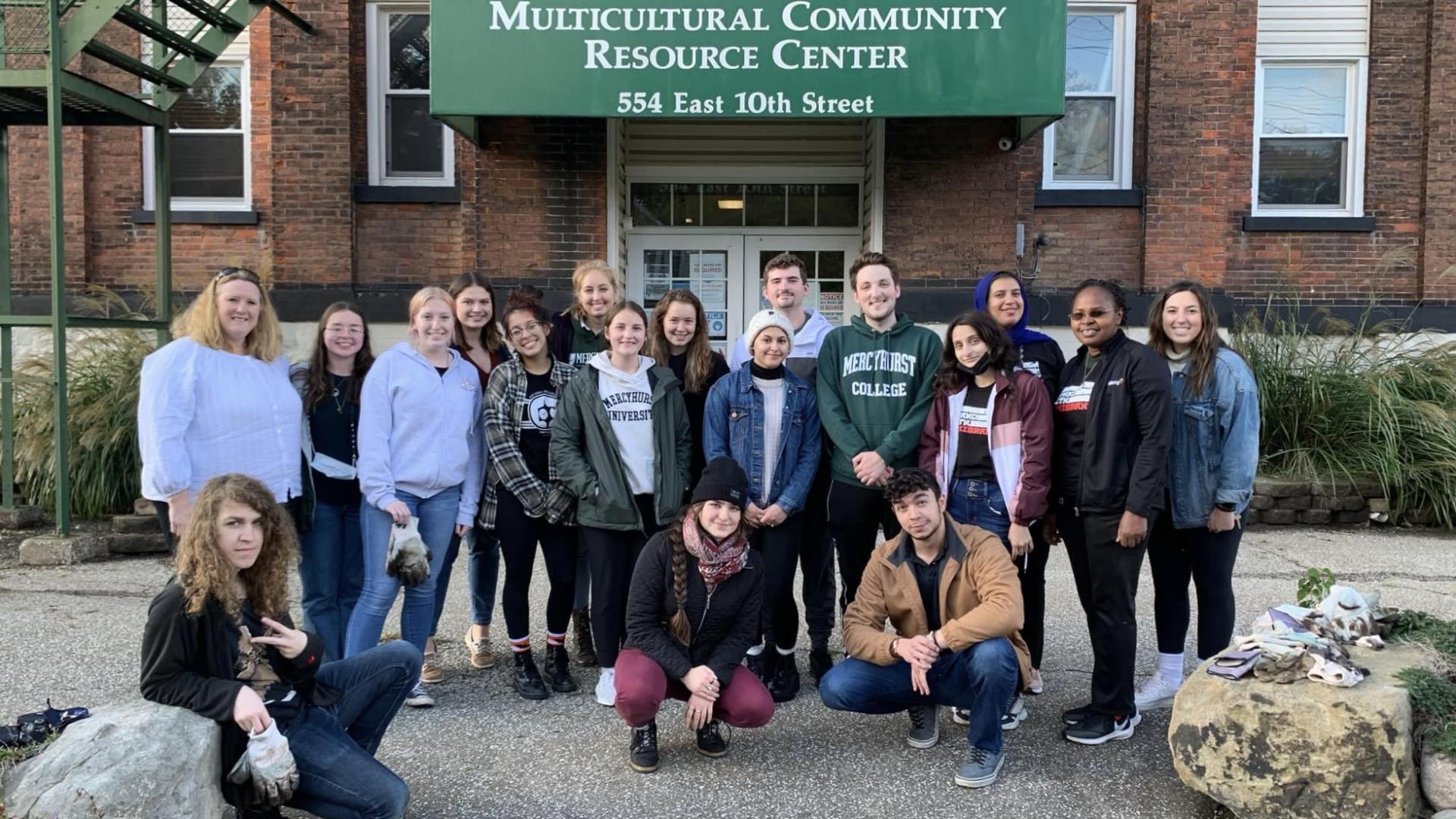 Migration Studies students taking a group photo at the Multicultural Community Resource Center
