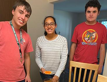 Students smiling and pose for photo