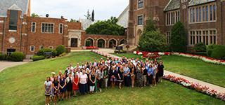 Alumni taking a group photo