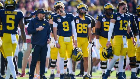 Kirk Campbell ’08 confers on the sidelines with Michigan QB J.J. McCarthy # 9 at the Rose Bowl. (Photo Courtesy University of Michigan Athletics)