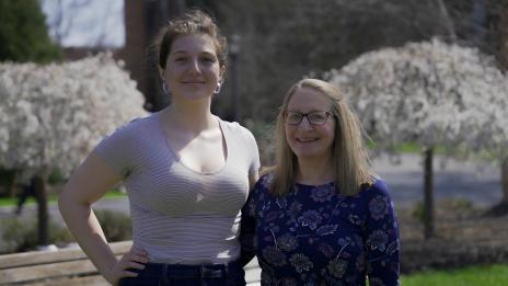 Truman Scholar award winner Marley Ramon and President Getz outside in the Mary Garden, posing for a picture