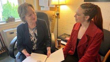 Dr. Christy Rieger shares her senior’s memoir with student Arie Danko