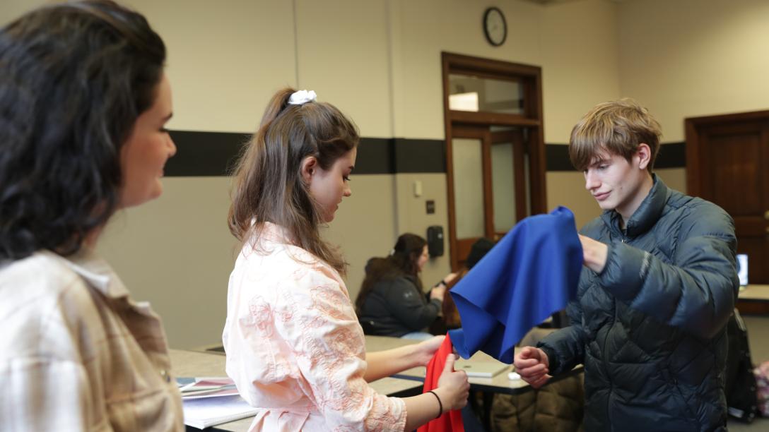 fashion merchandising students work with fabric