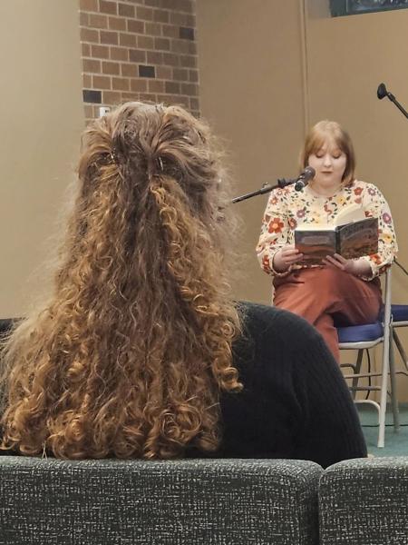 a female student attends a book reading