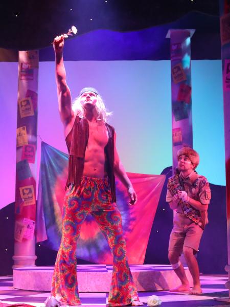 male students at center stage performing "A Midsummer Night's Dream"