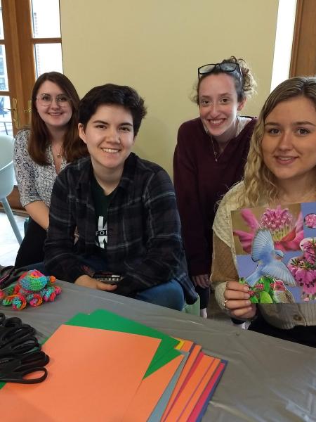 Group of female students posing with finished art