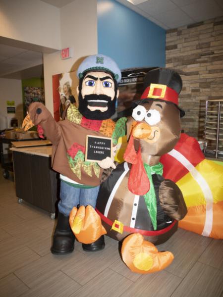 Luke standing with inflatable turkey 