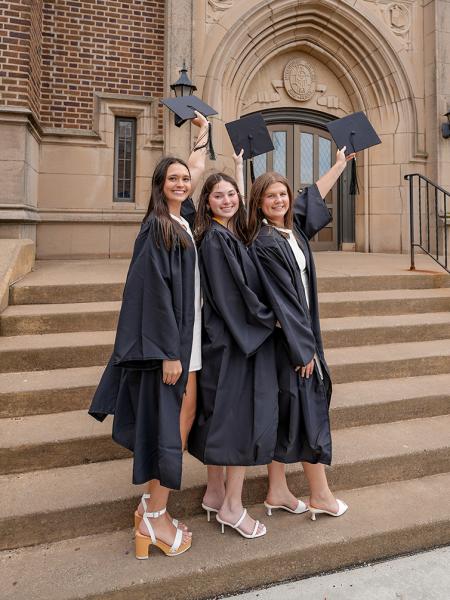 Female graduates outside of Old Main